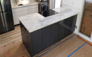 Island added for the same kitchen Remodel in Honolulu. Much more space for storage and looks modern. Work done by our Oahu General Contractor.